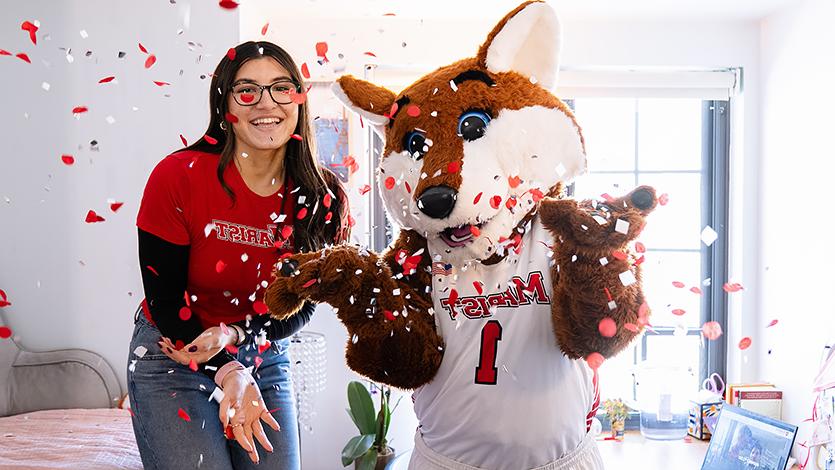 Image of student with Frankie the Fox.